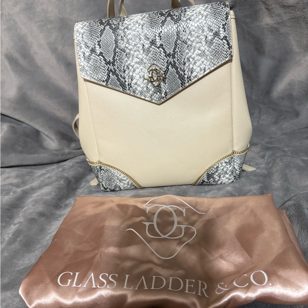 One of a kind. Cream Backpack with Snake-Print Accents